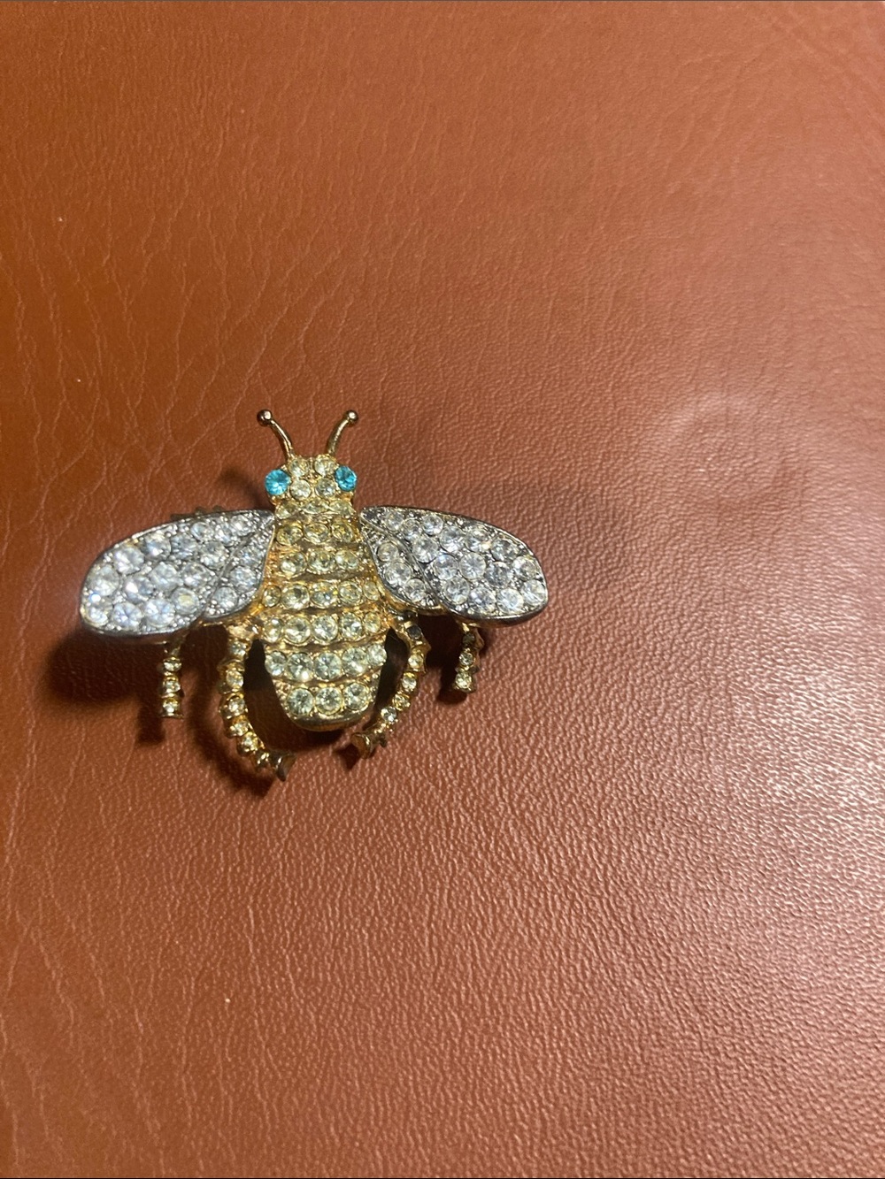 KJL KENNETH JAY LANE Gold Pave Crystal Bee Brooch with Blue Accent Eyes